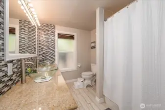 Main double sink bathroom wiht full tub/shower.  Lots of room to move around.