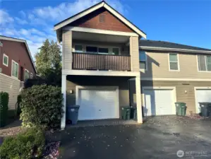 View from the back showing the deck and the garages below.