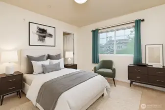 One of two bedrooms with attached bathrooms and walk in closets.