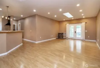 Light filled living room with pellet fireplace and French doors