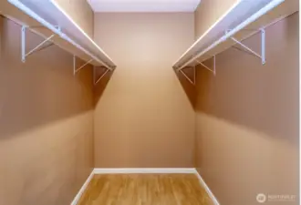 Primary bedroom walk in closet