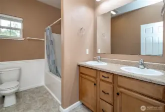 Full hall way with double sink vanity