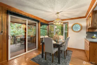 Dining area opens to deck access for entertainment-ease