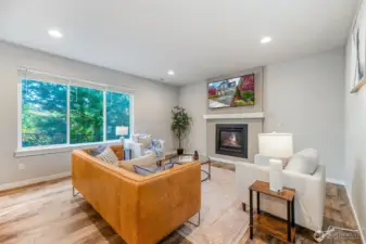 Open concept living room with gas fireplace and