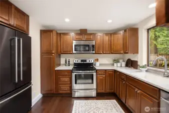 The kitchen offers plenty of cabinet and counter space.