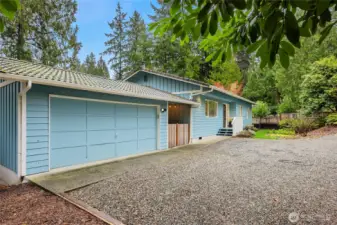 Covered breezeway for year-round convenience between main house and 2-car garage.