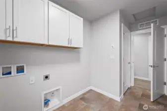 Laundry with upper cabinets