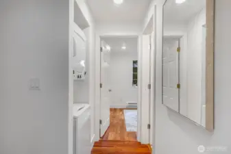 View towards 2nd br. 2nd bath on right and laundry on left