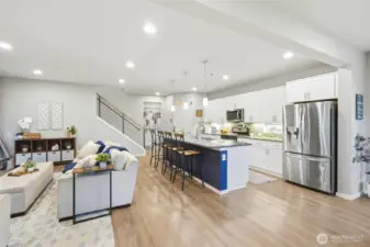 Expansive open-concept kitchen and living area with natural light, perfect for entertaining and everyday living in this Black Diamond WA home.