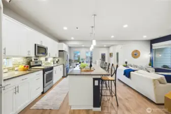 Open layout connecting kitchen, dining, and living spaces with seamless flow, ideal for gatherings and maximizing usable square footage.Open layout connecting kitchen, dining, and living spaces with seamless flow, ideal for gatherings and maximizing usable square footage.