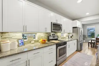 Gourmet kitchen with sleek cabinetry, granite surfaces, and high-end finishes offering both style and functionality for modern living.