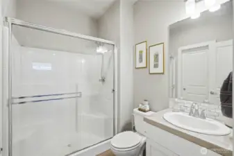 Modern bathroom with clean finishes, glass shower on the main, and updated fixtures providing comfort and style.
