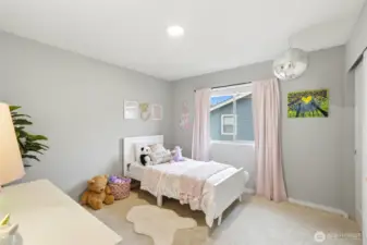 Spacious secondary bedroom with natural light, neutral tones, and flexible layout perfect for guests, kids, or office use.