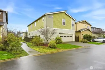 Exterior side / Rear view of home showcasing low-maintenance landscaping and modern construction in Ten Trails Black Diamond community.