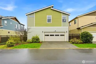 Rear exterior with attached 2-car garage, clean lines, and functional layout in this well-maintained Black Diamond WA home.