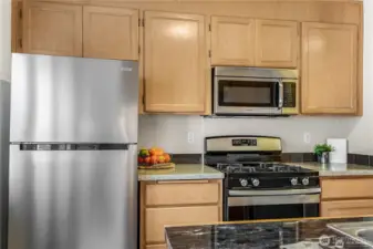 Stainless steel appliances and gas range.