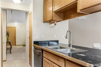 Kitchen area is open to dining room with entry to living room.
