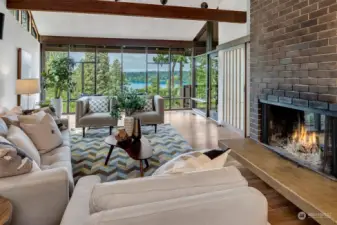 The lovely living room expands at an angle, reminiscent of Frank Lloyd Wright's architecture, to draw your eyes to the view.