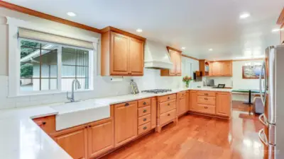 Enjoy the farmhouse apron sink with window looking out to your meticulously landscaped and cared for front yard.