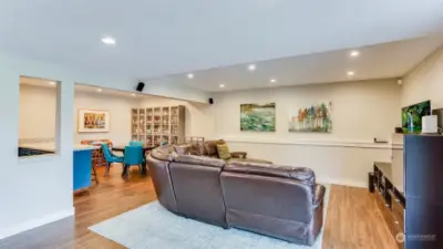 Beautiful laminate floors flow throughout this basement with tons of natural light and overhead lighting.