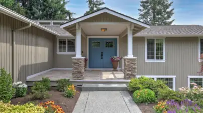 Pride in ownership shows from the moment you walk up to this home with an extended covered front porch and beautifully landscaped walkway.