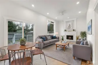 Virtually staged family room w/wood fireplace