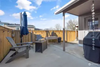 Clean & tidy patio space create a wonderful outdoor living space with covered BBQ area