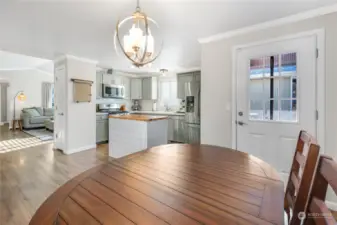 Wide open spaces make the kitchen & dining flow nicely, with door to outdoor patio and hot tub.  Room for table to be situated whichever way desired.