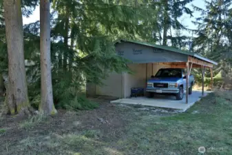 Storage shed with carport.