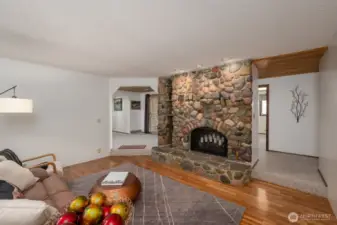 Living room with river rock fireplace