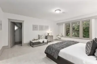 Oversized bedroom with window seats and two closets.  Plenty of room to add a bathroom and turn into a primary suite.