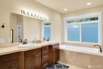 Luxurious travertine, modern fixtures.