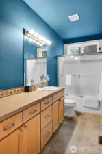 This is the main floor guest bath serving the 2 secondary bedrooms.