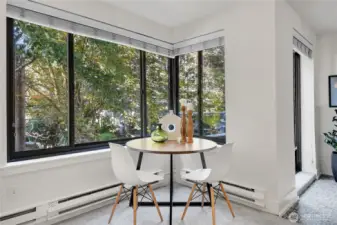 Sit at your dining table and gaze through the trees down Spring St.
