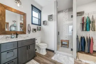 Double sinks, oversized luxury shower and a walk-in closet are all features of the primary bedroom.