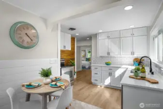 Kitchen with eating space, newer cabinets and quartz counters.