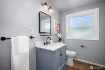 Full bath w/ updated plumbing & extra linen storage.