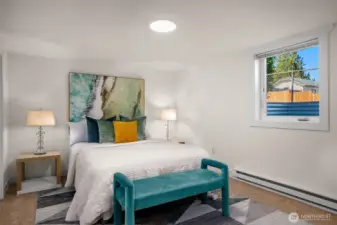 Large basement bedroom w/ new egress window.