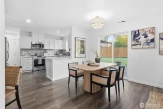 Dining area conveniently located next to kitchen and open to living area.