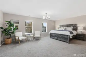 Spacious primary suite with enough room for a seating area.