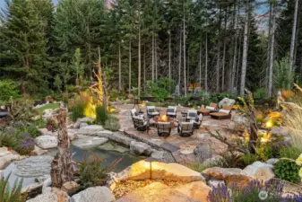 A jacuzzi spa and soaking pool set beside a tranquil waterfall