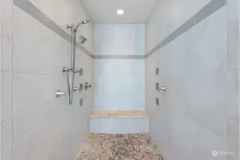 Now this is one magnificent shower. Its no-step entry is perfect for everyone. A large bench area beckons you to sit for bit and enjoy the warm water washing away the day's cares.