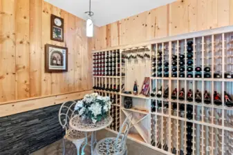 This wine cellar is truly sophisticated. A small area to let you sit and enjoy a glass of your favorite vino is like being in your favorite Italian town.