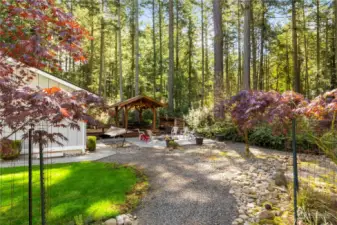 Mature landscaping and gravel walking paths throughout the property make this seem park like!