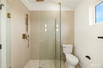 Spacious primary walk-in shower w/rain head shower head.