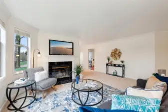 Living room with tile surround wood fireplace