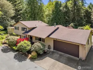 Nice and private approach home with a half-circle driveway.  Right into your 2-car garage or spacious asphalt drive