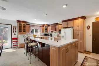 Elevated dishwasher for ergonomics, extra seating at the bar and new French doors that take you out to the deck and yard.
