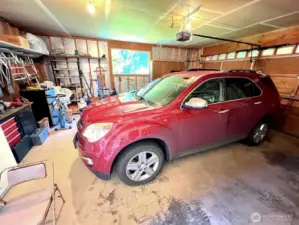 2 car garage with a side door and space for workshop