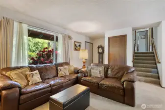 Entrance in the corner, delivers you right into the living room.  This tri-level has just 8 steps to the bedrooms and bathrooms